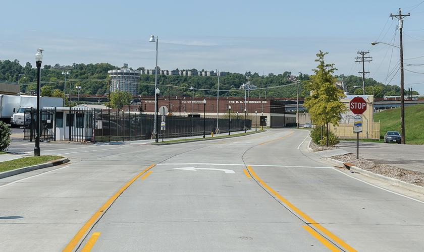 Corridor Improvements - New fenced IRS parking lot access (left), floodwall pump house (right) - Covington, KY